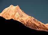 Manaslu 07 03 Manaslu Medium Shot Sunrise From Syala Wow! The subtle changes of the light on Manaslu are terrific. Manaslu (8156m) is said to derive from the Sanskrit word Manasa, which means soul; therefore Manaslu is the Mountain of the Soul. It was earlier known as Kutang I, while the Survey of India�s symbol was merely Peak XXX. According to Snelgrove, the local Tibetan name for Manaslu is Pung-gyen, which is also the name to the god who resides on it.